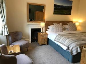 Ένα ή περισσότερα κρεβάτια σε δωμάτιο στο May Cottage B&B