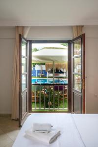 a room with a view of a pool through a sliding glass door at B&B Boutique Hotel in Dalyan