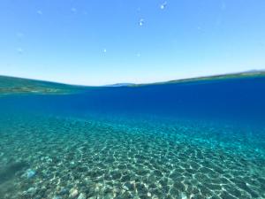 a view of the ocean from under the water at Ktima Tzaneti - Coastal Farmhouse in Lachania