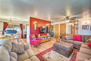 a living room with two couches and a tv at Eco-Friendly Escape in Cortez - Pets Welcome! in Cortez