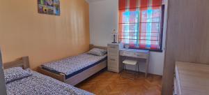 Postel nebo postele na pokoji v ubytování DLX Apartman Adriatics