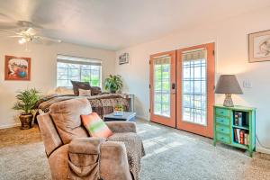 a living room with a couch and a bed at Romantic Treetop Studio 30 Mi to Yosemite! in Coarsegold