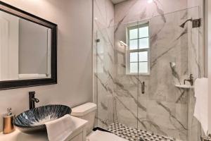a bathroom with a sink and a shower at St Pete Escape with Patio and Yard 6 Mi to Beach in St Petersburg +25 photos
