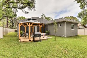 a gazebo in the backyard of a house at St Pete Escape with Patio and Yard 6 Mi to Beach in St Petersburg