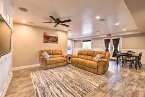 a living room with two couches and a ceiling fan at La Verkin Family Apartment - 21 Miles to Zion! in La Verkin