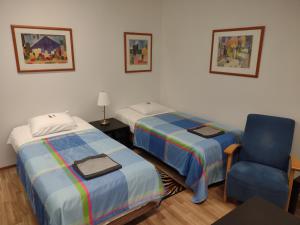 Postel nebo postele na pokoji v ubytování Hotel 24 - Karihaara - Kemi