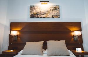Postel nebo postele na pokoji v ubytování Ferreira Hostal Boutique
