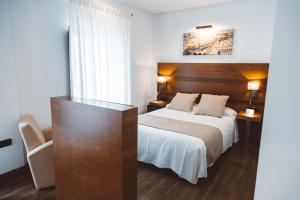 Postel nebo postele na pokoji v ubytování Ferreira Hostal Boutique
