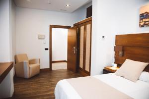 Postel nebo postele na pokoji v ubytování Ferreira Hostal Boutique
