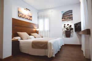 Postel nebo postele na pokoji v ubytování Ferreira Hostal Boutique