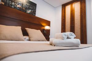 Postel nebo postele na pokoji v ubytování Ferreira Hostal Boutique
