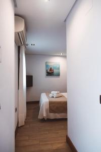 Postel nebo postele na pokoji v ubytování Ferreira Hostal Boutique