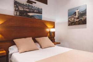 Postel nebo postele na pokoji v ubytování Ferreira Hostal Boutique