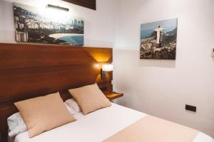 Postel nebo postele na pokoji v ubytování Ferreira Hostal Boutique