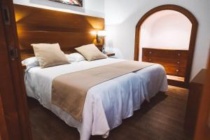 Postel nebo postele na pokoji v ubytování Ferreira Hostal Boutique