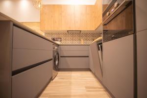 Kuchyň nebo kuchyňský kout v ubytování Nabrisa apartamento moderno en pleno centro con opción a parking
