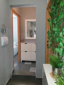 a bathroom with a white dresser and a mirror at CASA RURAL A PIE DE PLAYA Remodelada 2024 in Chipiona +56 photos