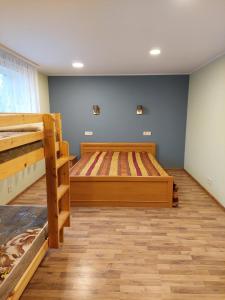a bedroom with two bunk beds in a room at Brīvdienu māja Saulīte in Ventspils