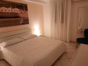 Cama ou camas em um quarto em Villa Oblò