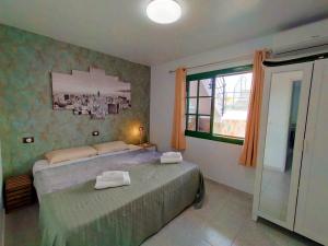 Posteľ alebo postele v izbe v ubytovaní CALMA SUITES Maspalomas + 35 fotografií