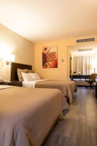 Postel nebo postele na pokoji v ubytování Hotel Rocaval San Cristóbal de las Casas