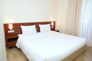 Postel nebo postele na pokoji v ubytování Park Resort Aghveran