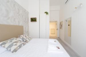 Postel nebo postele na pokoji v ubytování White Gioberti Guesthouse