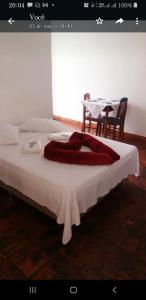 En eller flere senge i et værelse på Pousada Casarão da Pedra
