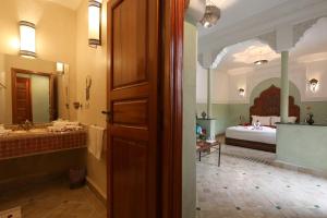 Postel nebo postele na pokoji v ubytování Riad Atlas Acacia