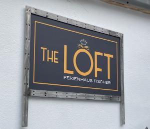 a sign on a wall that reads the loot at FichtelLOFT Retreat-Design Loft nahe Bayreuth in Goldkronach