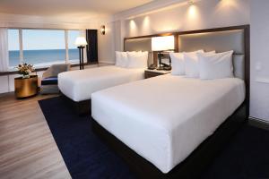a hotel room with two beds and two lamps at Bally's Atlantic City Hotel & Casino in Atlantic City