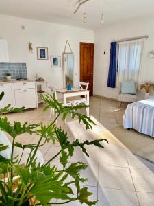 a living room with a bed and a table at La Dimora di Ulisse in Santa Cesarea Terme