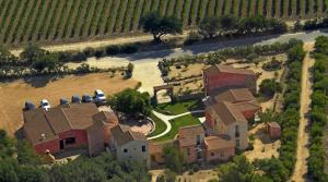an aerial view of a house in a vineyard at Hotel La Corte Rosada in Villasimius