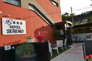 a hotel serrano sign on the side of a building at Hotel Sereno in Sestri Levante