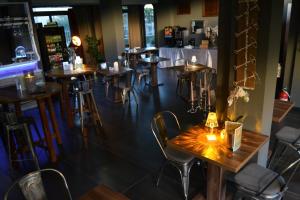 a restaurant with tables and chairs and a bar at Hotel Sereno in Sestri Levante