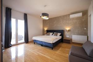 Postel nebo postele na pokoji v ubytování Apartments Škara