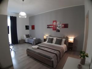 Postel nebo postele na pokoji v ubytování B&B Costa Sicula