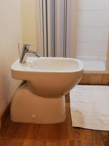 a bathroom with a sink and a toilet at Lo Studio in Terranuova Bracciolini