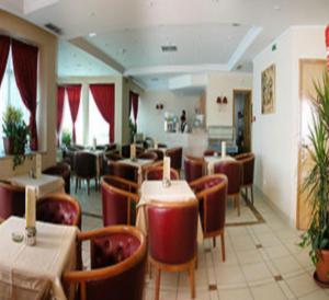 En restaurant eller et spisested på Ariha Hotel