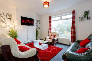 a living room with two couches and a red rug at Staywhenever HS- 4 Bedroom House, King Size Beds, Sleeps 9 in Stoke on Trent