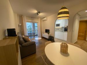 A television and/or entertainment centre at Arenales Sol y Playa Galatea I