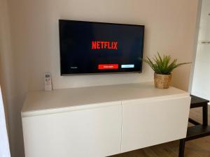 A television and/or entertainment centre at Arenales Sol y Playa Galatea I
