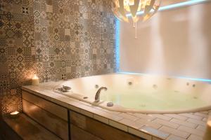 a bath tub in a bathroom with a window at Syrah Studios in Buenos Aires +14 photos