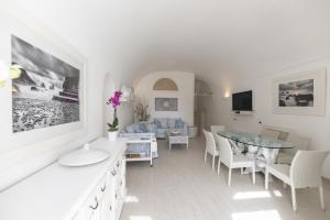 a living room with a table and a couch at Capri center holidays in Capri