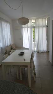 Posezení v ubytování Departamentos Punta Pampa