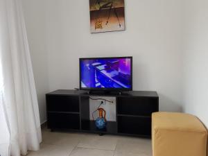 TV a/nebo společenská místnost v ubytování Departamentos Punta Pampa