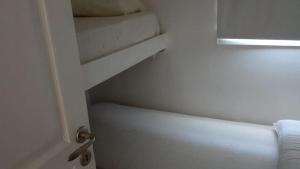 Postel nebo postele na pokoji v ubytování Departamentos Punta Pampa + 4 fotografie