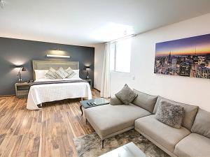 A bed or beds in a room at Hotel CLARUM 101