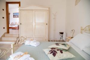 Letto o letti in una camera di Dimora Aia Piccola