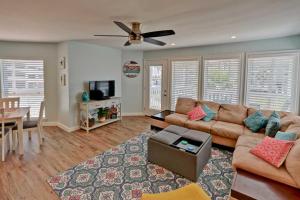 a living room with a couch and a table at Gulfpoint 3209 in South Padre Island +19 photos